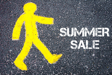 Yellow pedestrian figure walking towards SUMMER SALE