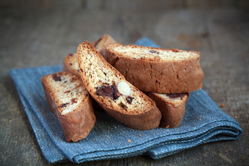 Homemade biscotti with chocolate and almonds on a wooden table