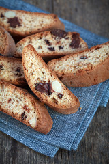 Homemade biscotti with chocolate and almonds on a wooden table