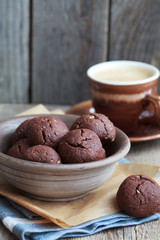 Italian chocolate cookies with walnuts and a cup of coffee