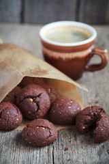Italian chocolate cookies with walnuts and a cup of coffee