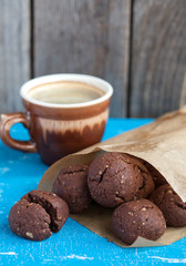 Italian chocolate cookies with walnuts and a cup of coffee
