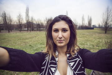 Fototapeta premium Young girl take a selfie outdoor