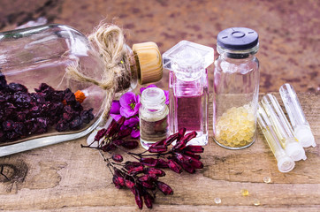 essential oil and herbals in glass bottles