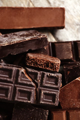 Set of chocolate on wooden table, closeup