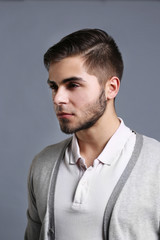 Obraz premium Portrait of young man on gray background