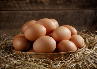  egg in a basket on the dried grass