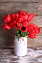 Beautiful tulips on wooden background