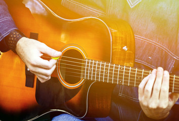 Man playing acoustic guitar © irishmaster