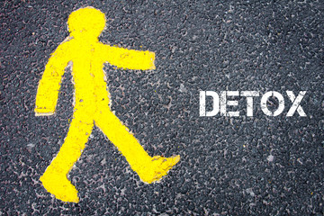 Yellow pedestrian figure walking towards DETOX