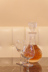 Emty glass and bottle glass of whisky on wood table