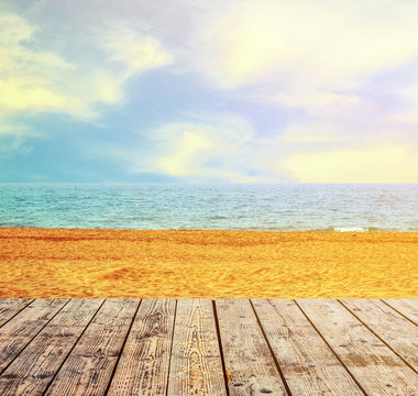 Sandy beach and seascape with wooden floor