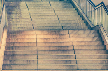 Long outdoor concrete stairs at night time..