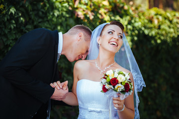 Bride and Groom at wedding Day walking Outdoors on spring nature
