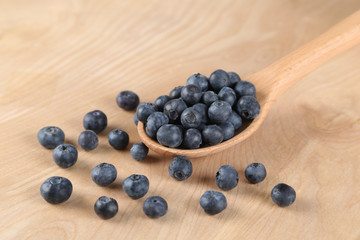 Blueberries in a wooden spoon