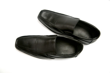 Black glossy man shoe isolated on white background