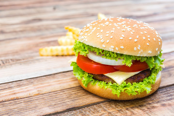 Hamburger on wood table ,sun flare filter effect
