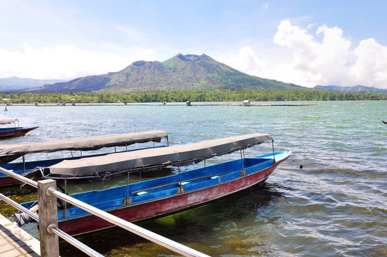 boats in front of volcano Batur in Lake. Indonesia, Bali