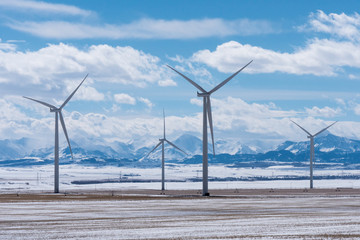 Wind Turbines with Rocky Mountains in the Winter