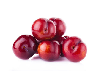 plums isolated on white