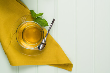 Herbal tea with melissa in a glass cup