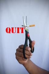 concept no smoking,man use scissor cutting cigarette