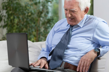 Senior man with a laptop