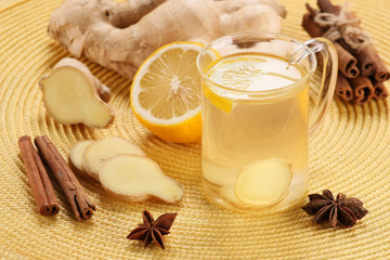 ginger tea in a cup of glass, ginger, lemon, cinnamon, star anis