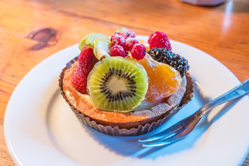 fresh fruit pie tart with kiwi, blueberry, orange and strawberry