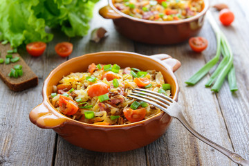 Stewed cabbage with tomatoes, onions and sausages