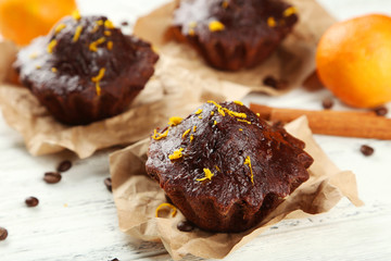 Chocolate cupcake on white wooden background