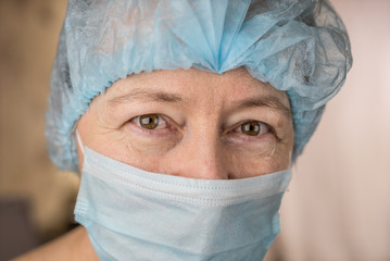 Smiling female doctor in hospital hallway