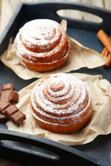 Cinnamon buns with chocolate in blue tray