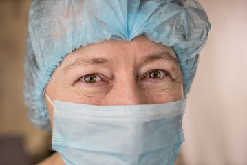 Smiling female doctor in hospital hallway