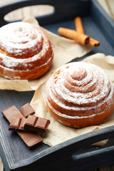 Cinnamon buns with chocolate in blue tray
