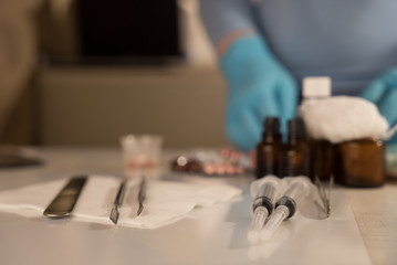 Obraz na płótnie Canvas Syringe with glass vials and medications pills drug
