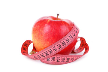 Red apple with measuring tape isolated on white