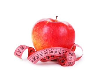 Red apple with measuring tape isolated on white