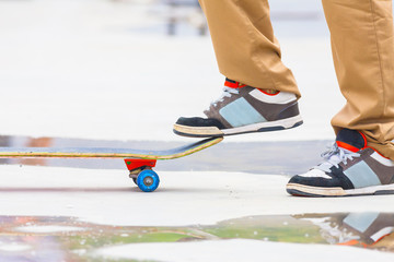Fototapeta na wymiar skateboarder riding a skateboard on the street or park