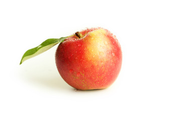 Red apple with leaf isolated on white