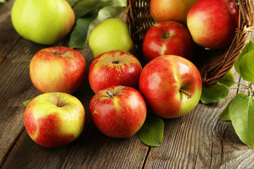Beautiful apples on brown wooden background