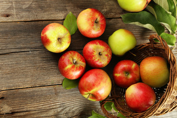 Beautiful apples on brown wooden background