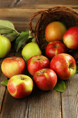 Beautiful apples on brown wooden background