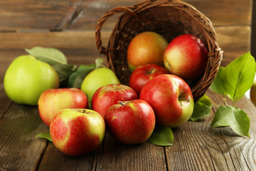 Naklejka na ściany i meble Beautiful apples on brown wooden background