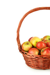 Beautiful apples in basket on white background