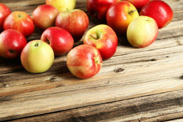 Apples on brown wooden background
