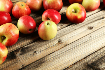 Apples on brown wooden background