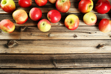 Apples on brown wooden background