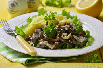 Beef liver stewed with mushrooms and onion in a sour cream.