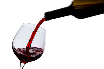 Fototapeta na wymiar wine is poured into a glass on a white background